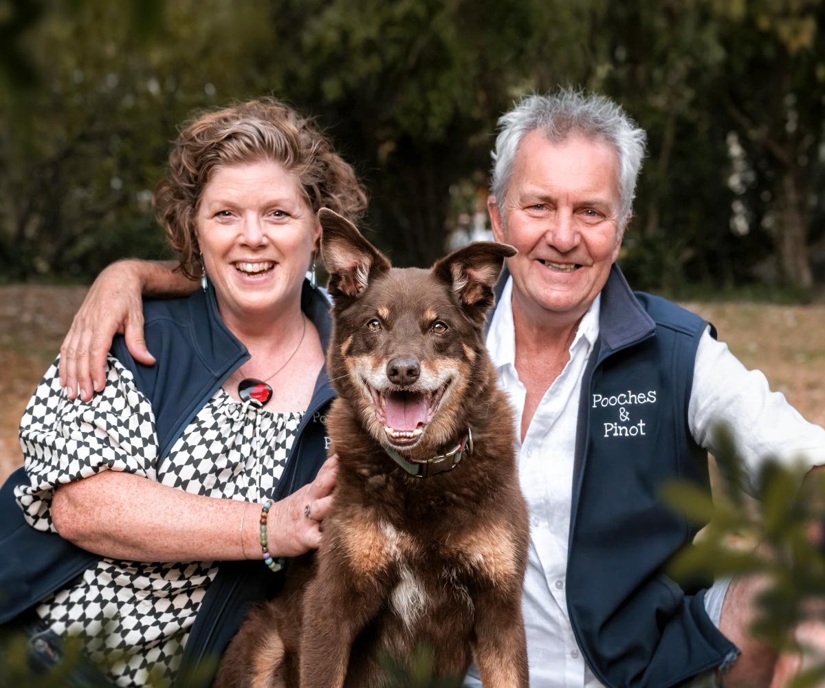 Pooches & Pinot Tour Crew Helen and Jeff sitting with their dog Henry